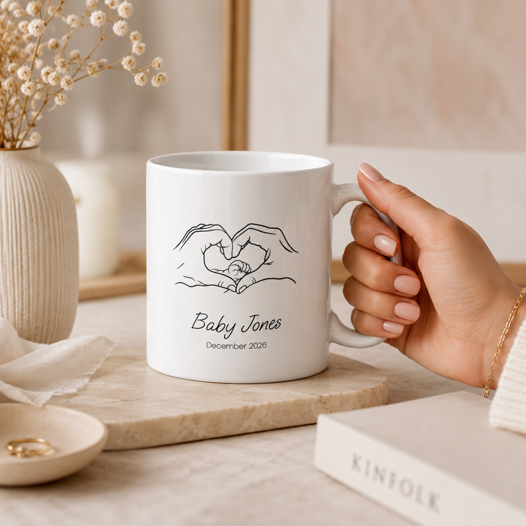 Personalized heart hands baby announcement mug shown from the side