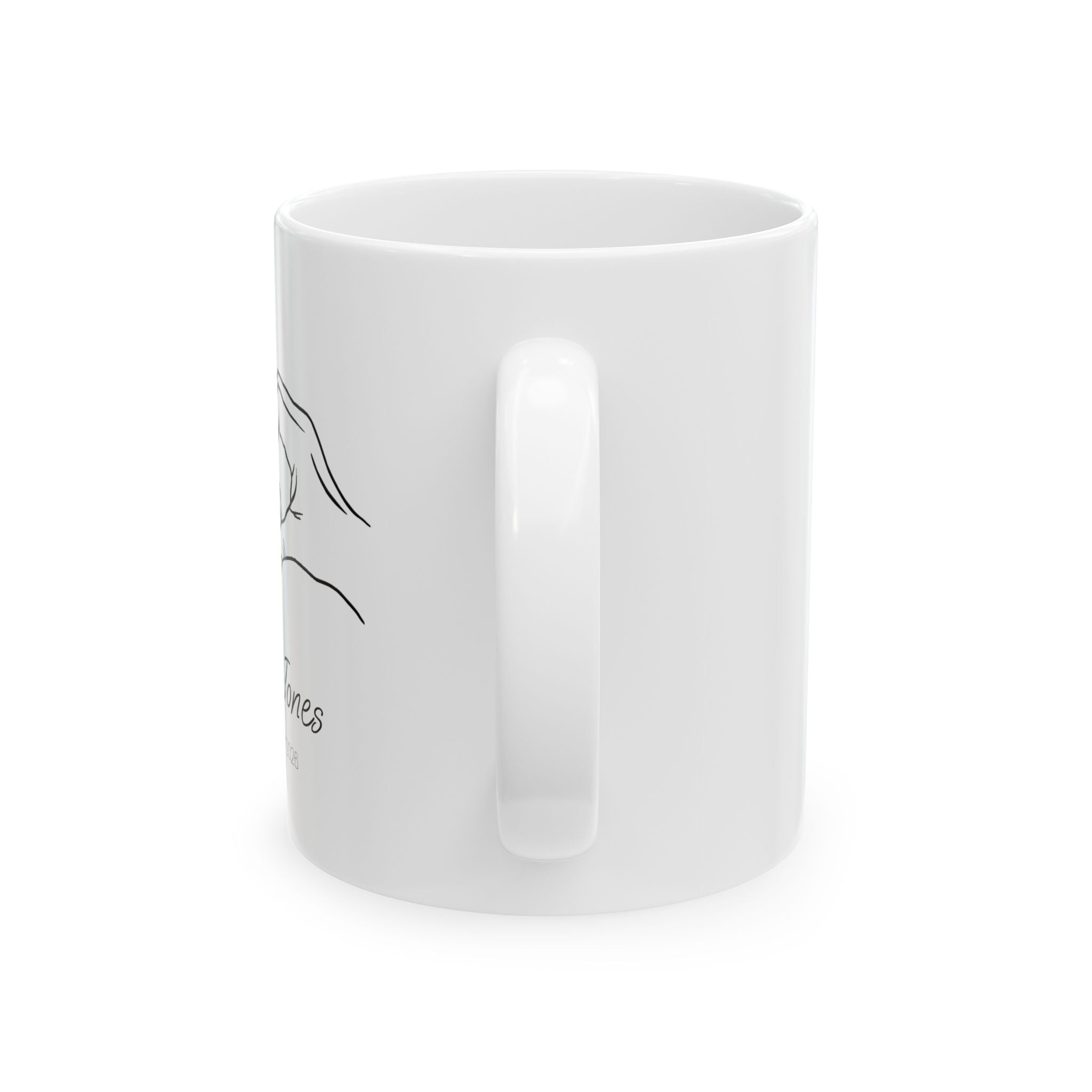 Personalized heart hands baby announcement mug shown on a table as a baby shower gift
