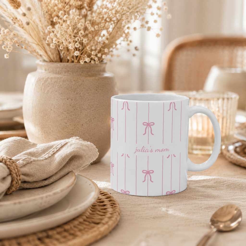 Personalized pink bow pattern mug displayed as a gift