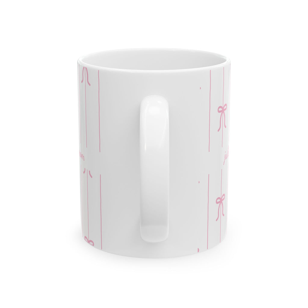Personalized pink bow pattern mug held in hand
