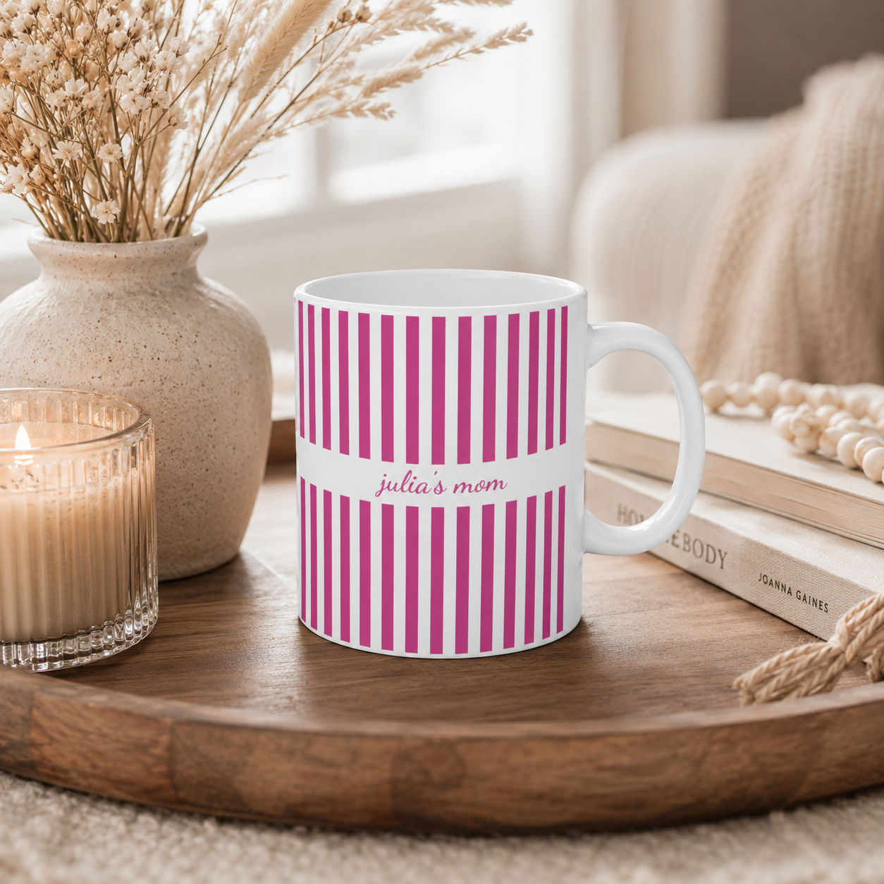 Personalized pink stripe pattern mug displayed on a desk