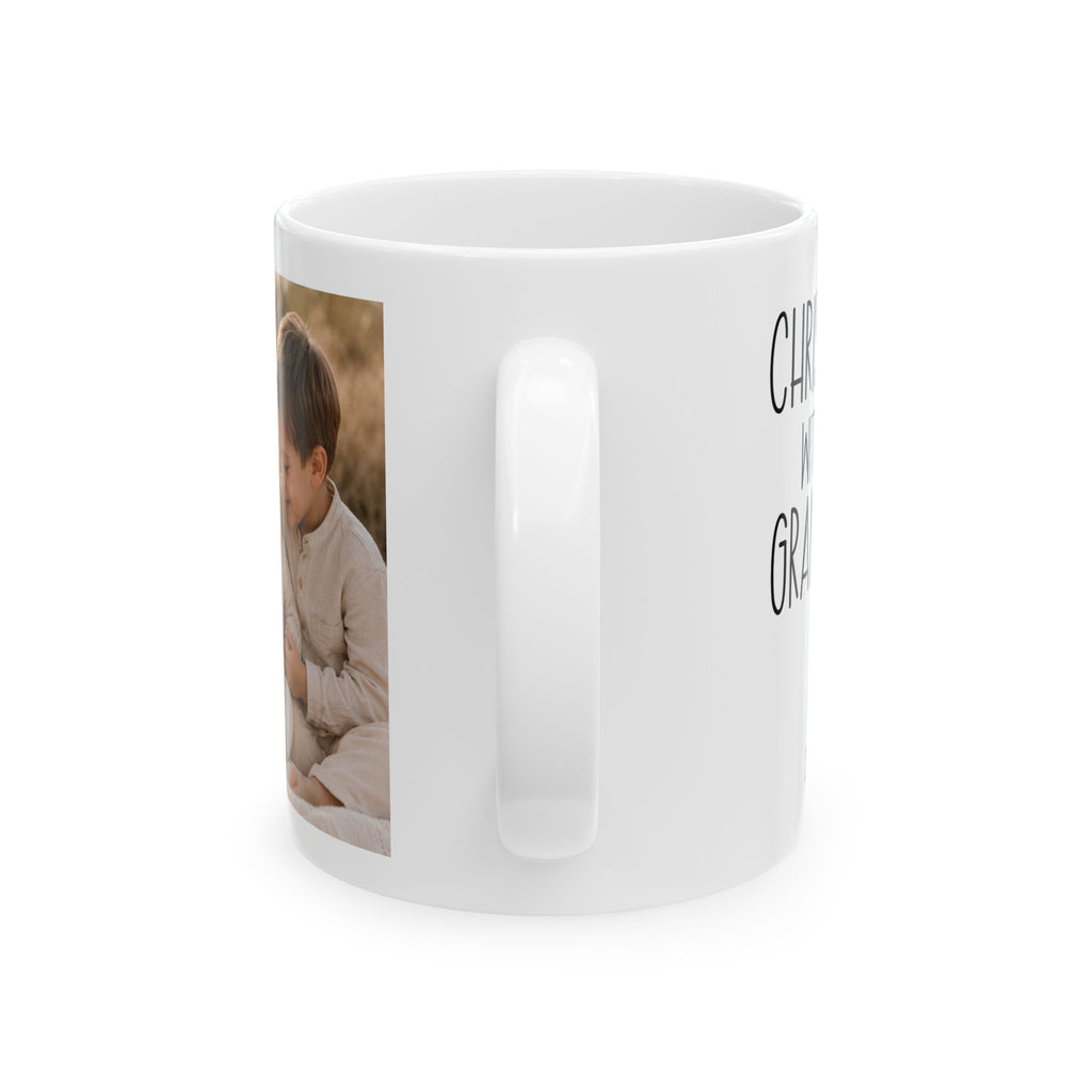 Personalized Christmas with grandkids photo mug shown on a table as a Christmas gift