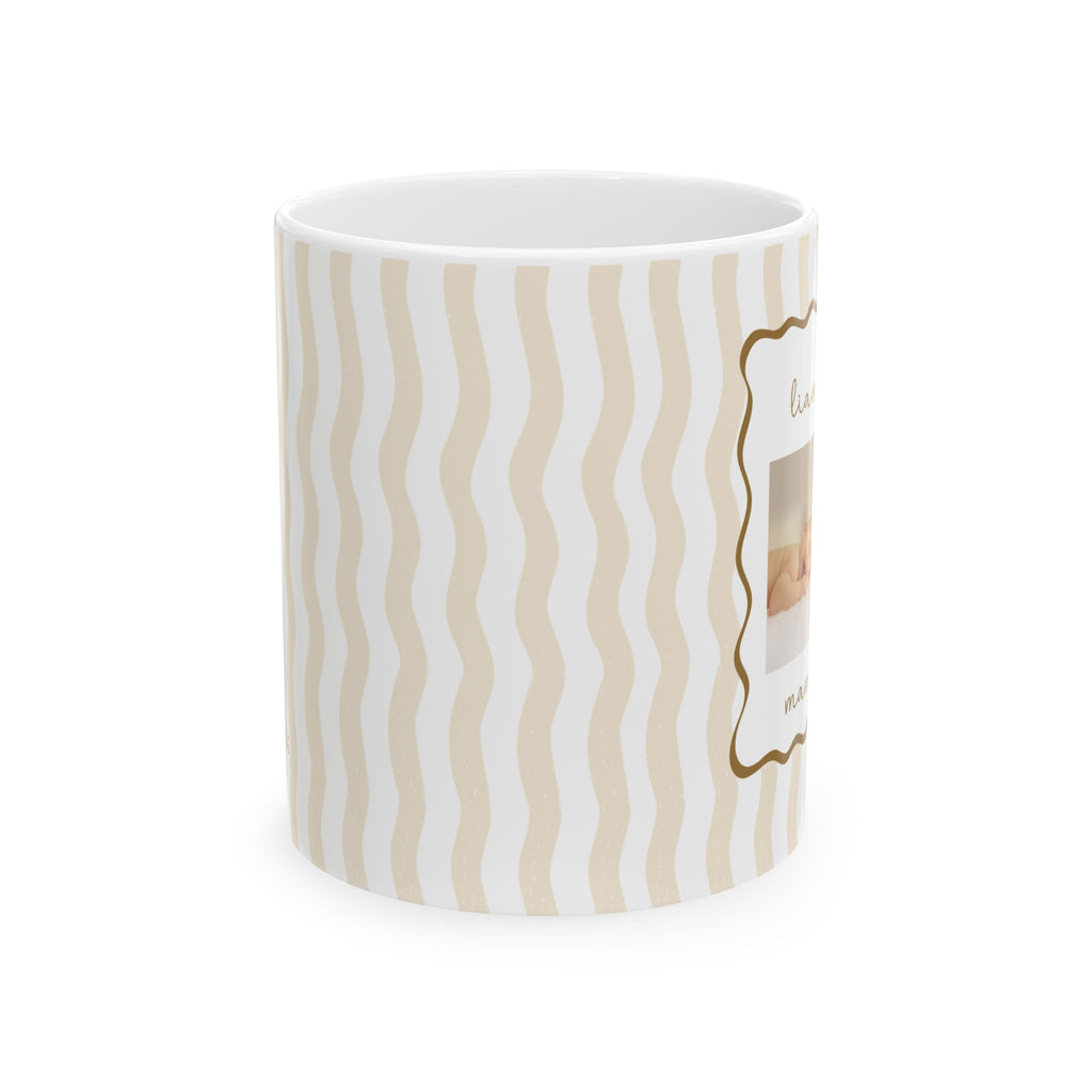 Personalized baby photo frame mug displayed on a desk