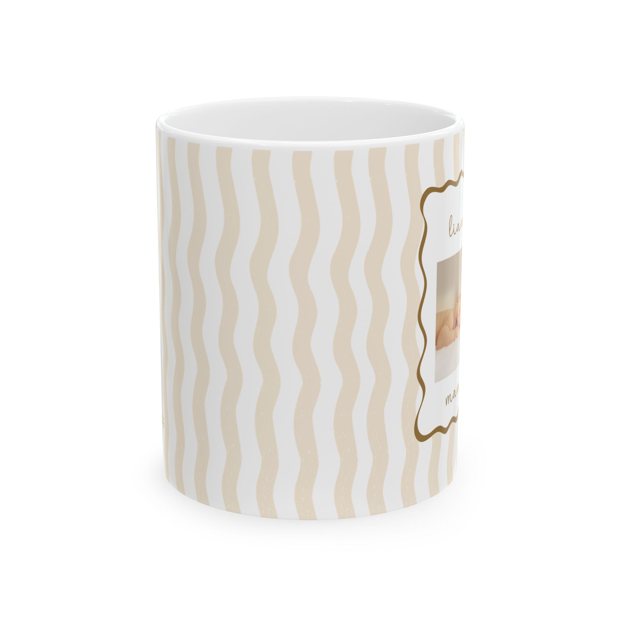 Personalized baby photo frame mug displayed on a desk